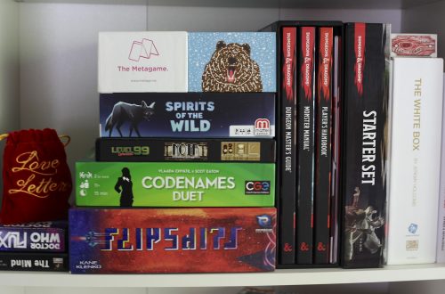 board games and books on a shelf, gifts for board game lovers