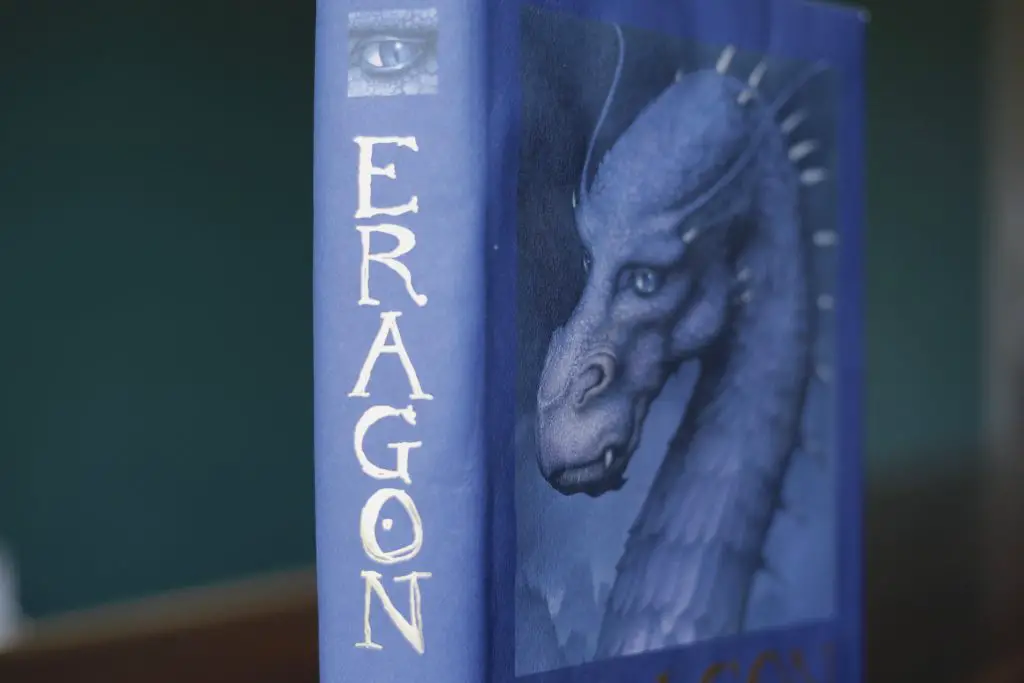blue cover of Eragon fantasy book with a dragon on the front