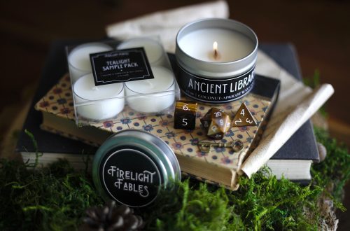 Candle sets from Firelight Fables on top of books
