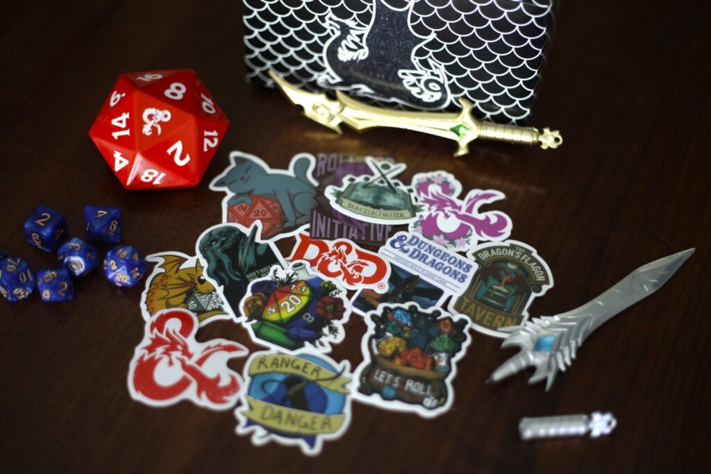 A collection of D&D items for a D&D birthday party gift bag.